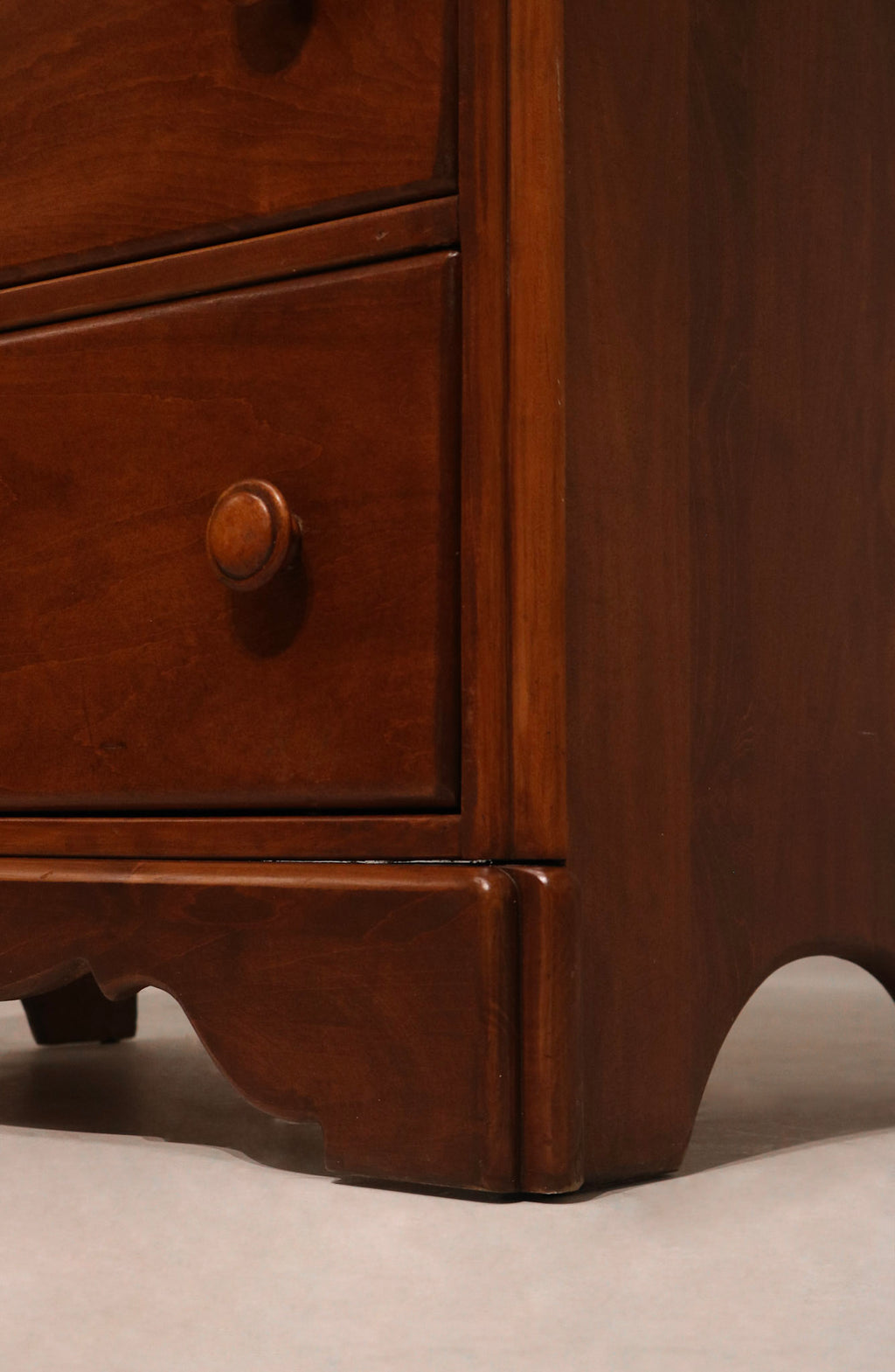 Detail of drawer interior highlighting spacious storage compartments in maple wood