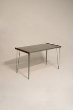 Heavy-duty steel table with iron legs and wood sides