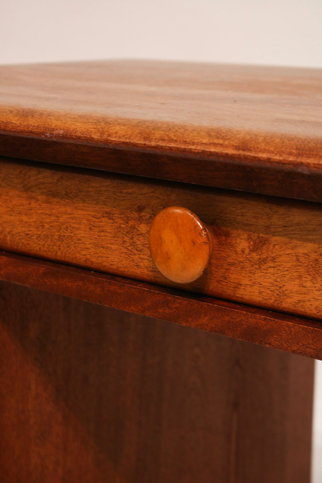 Zoom on desktop surface to show natural wear, stains, and patina on solid maple
