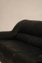Underneath view of vintage sofa showing sturdy wooden frame and fine leather wrap