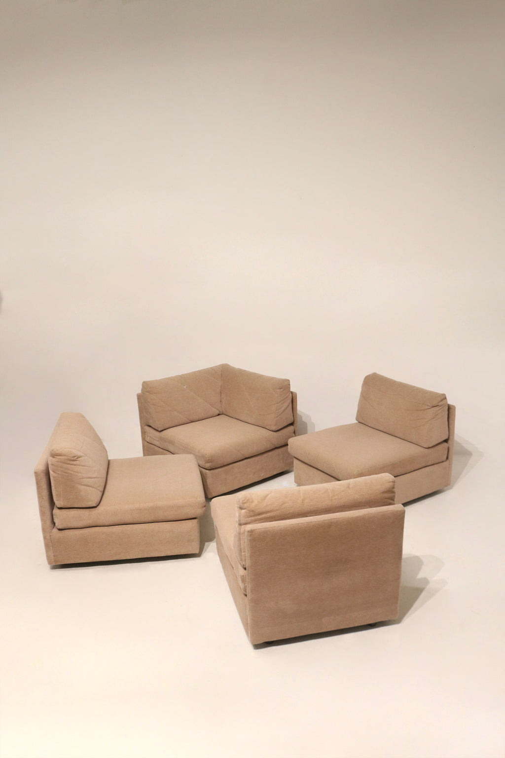 Detail of seat cushion underside and zipper on fabric modular sofa showing removable cushion cover and construction details
