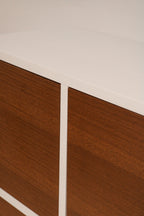 Detailed close-up of iron legs supporting the cabinet, emphasizing industrial design