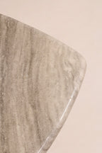 Bottom view showing table’s solid marble construction and finishing details