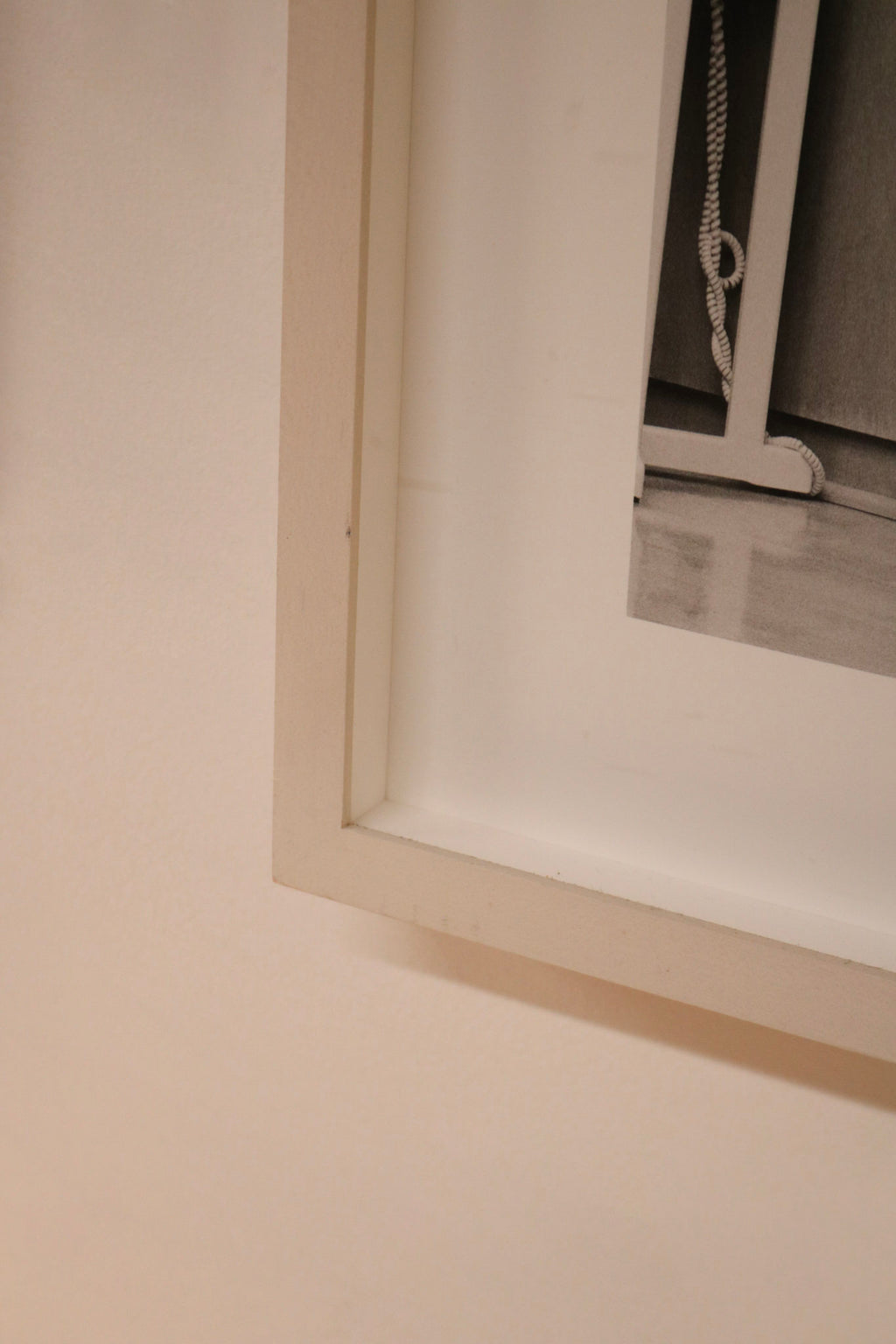 Lighting reflection showing matte vs. gloss texture differences on framed Tony Hawk art print