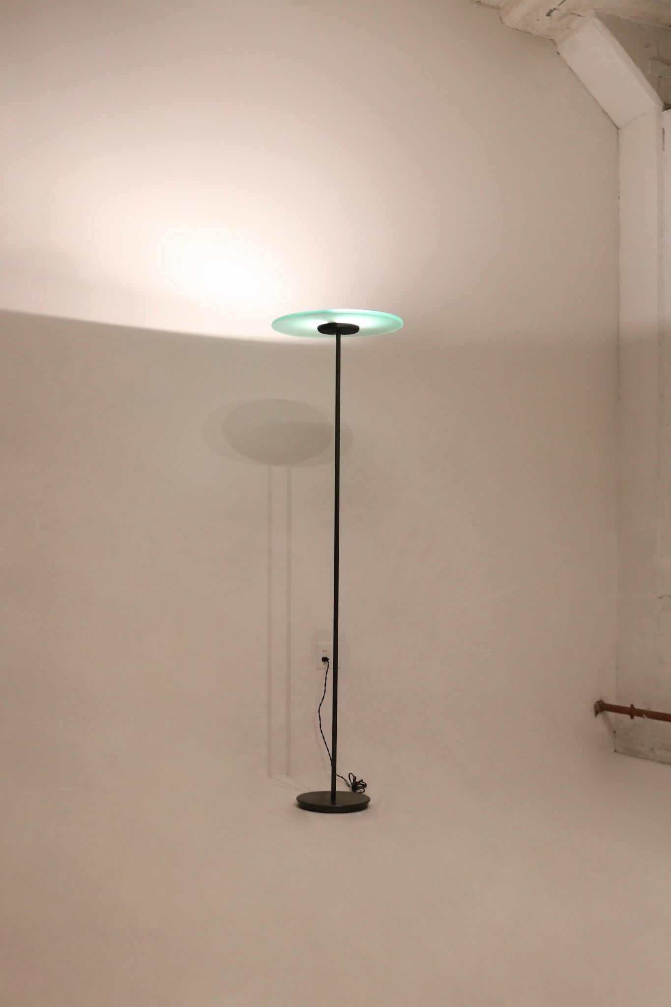 Full view of vintage Italian floor lamp by Cini & Nils featuring tall elegant glass body and sleek mid-century design