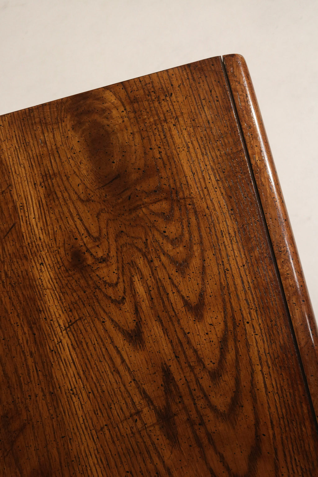 Close-up of vintage metal drawer pulls and hardware mounted on walnut fronts, original mid-century hardware with warm patina and secure fit. Perfect for NYC apartments.
