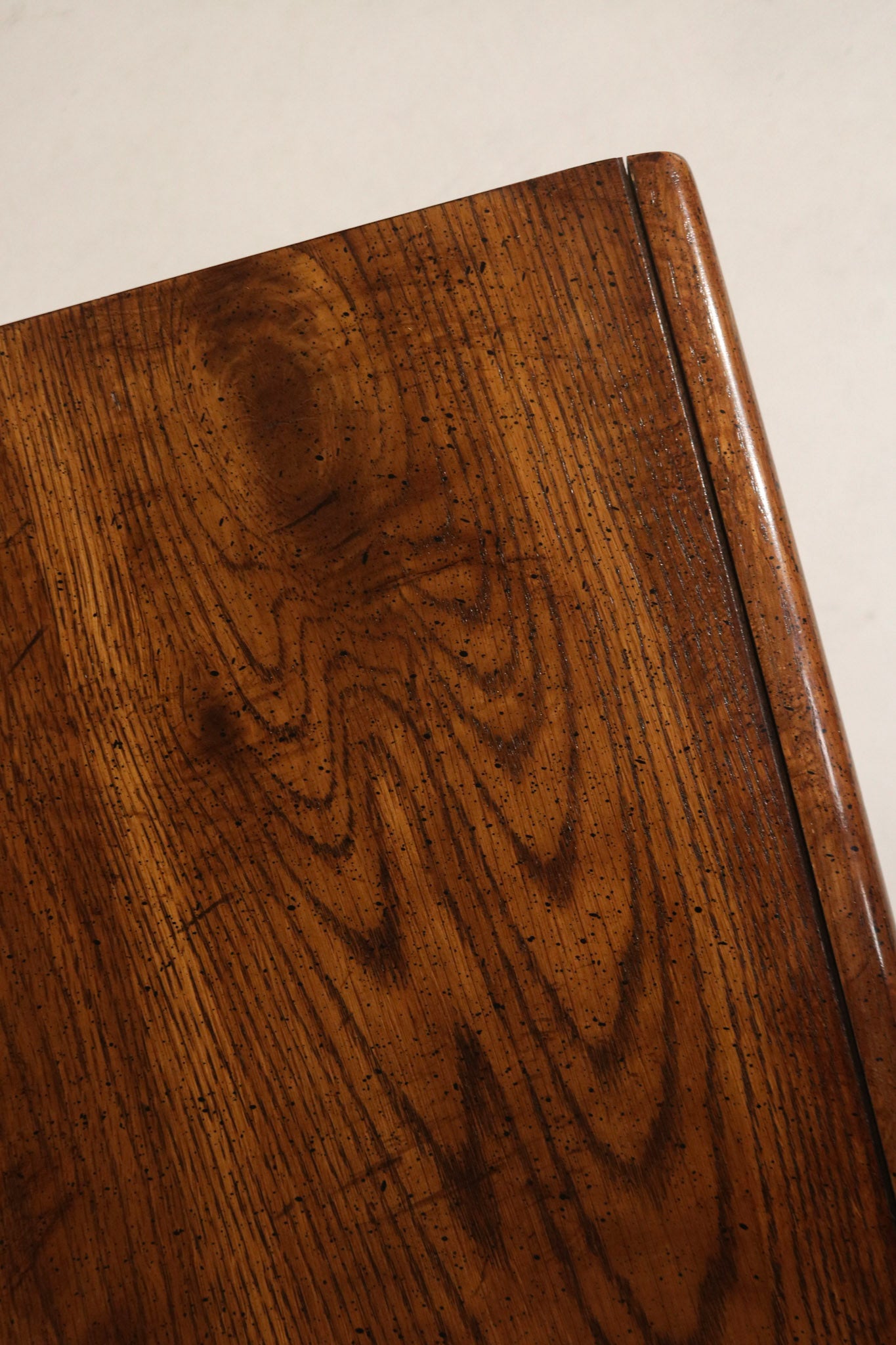Close-up of vintage metal drawer pulls and hardware mounted on walnut fronts, original mid-century hardware with warm patina and secure fit. Perfect for NYC apartments.