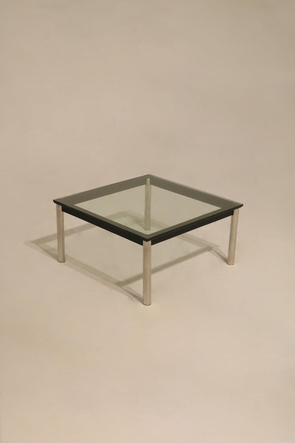 Front view of Vintage Mcm Square Glass Steel Coffee Table with clear thick glass and silver steel base