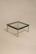 Front view of Vintage Mcm Square Glass Steel Coffee Table with clear thick glass and silver steel base