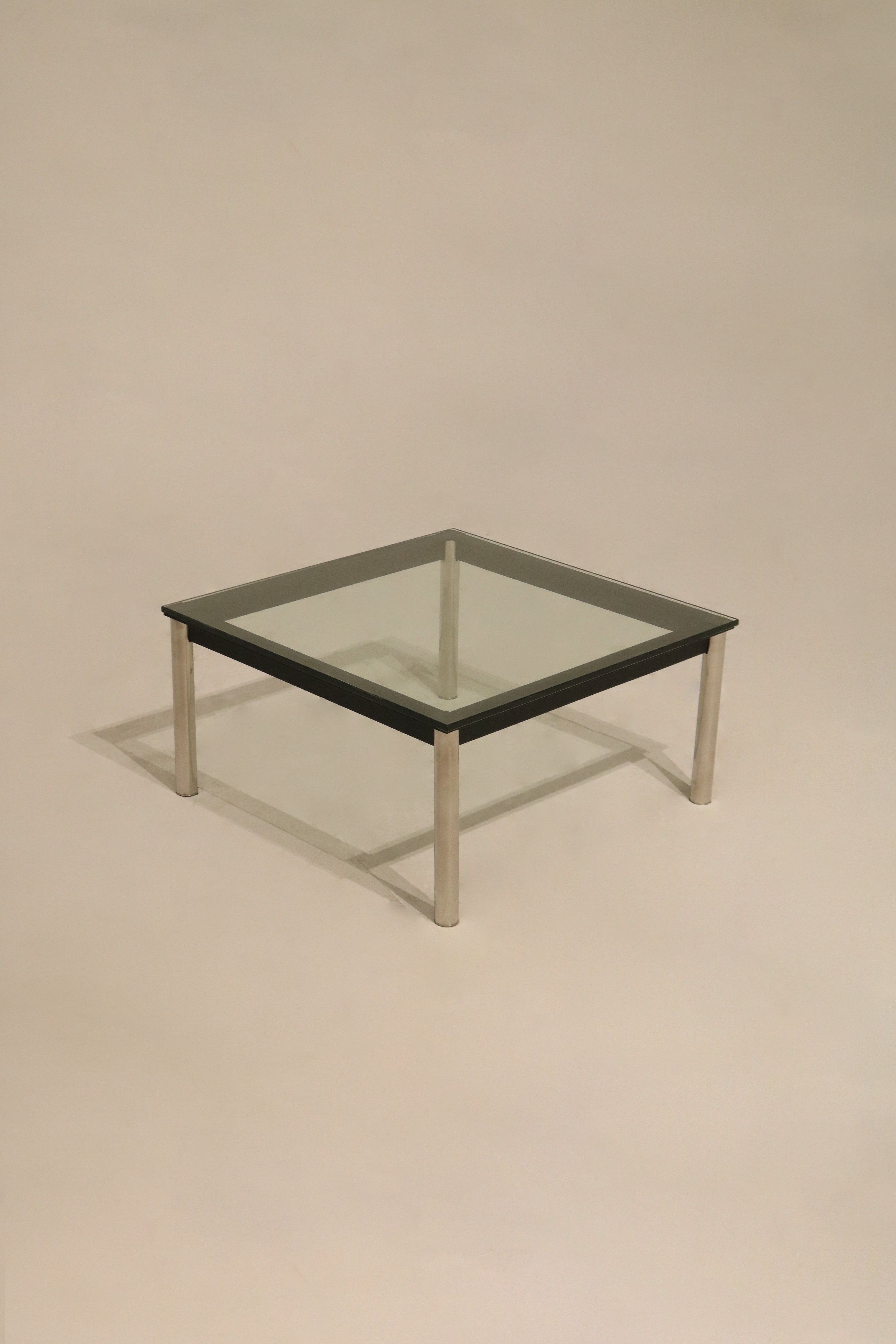 Front view of Vintage Mcm Square Glass Steel Coffee Table with clear thick glass and silver steel base