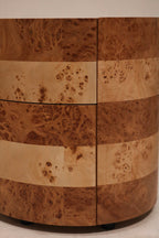 Close-up of top drawer with soft-close pull-open mechanism and burl wood veneer texture