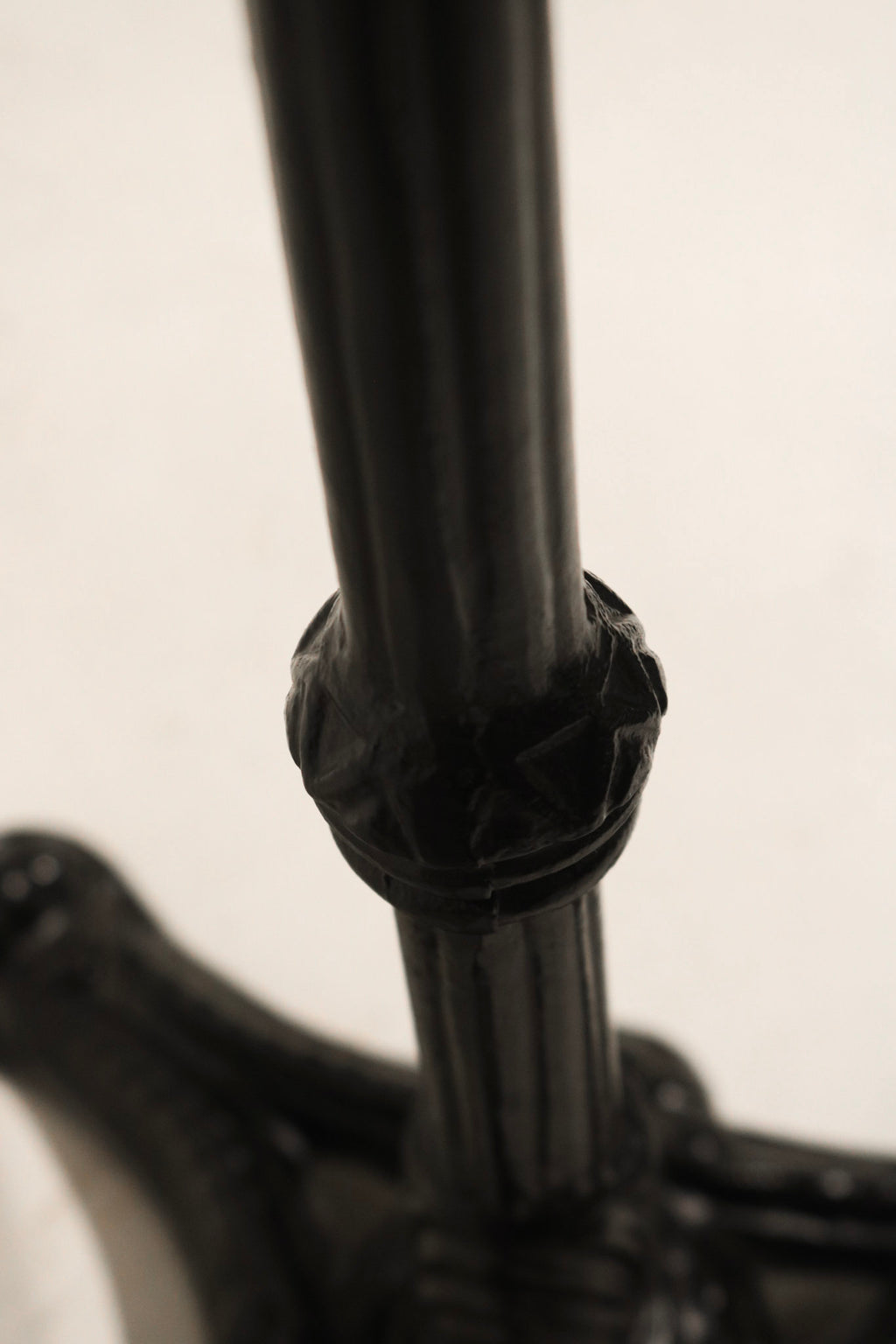 Underneath view of iron structure supporting stone tabletop on Vintage Bistro Table for added durability