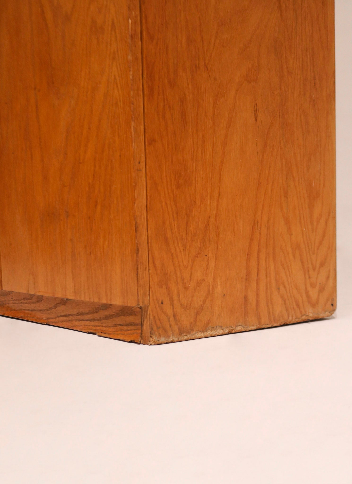 Back view of oak bookcase showing construction and support details in natural wood tone