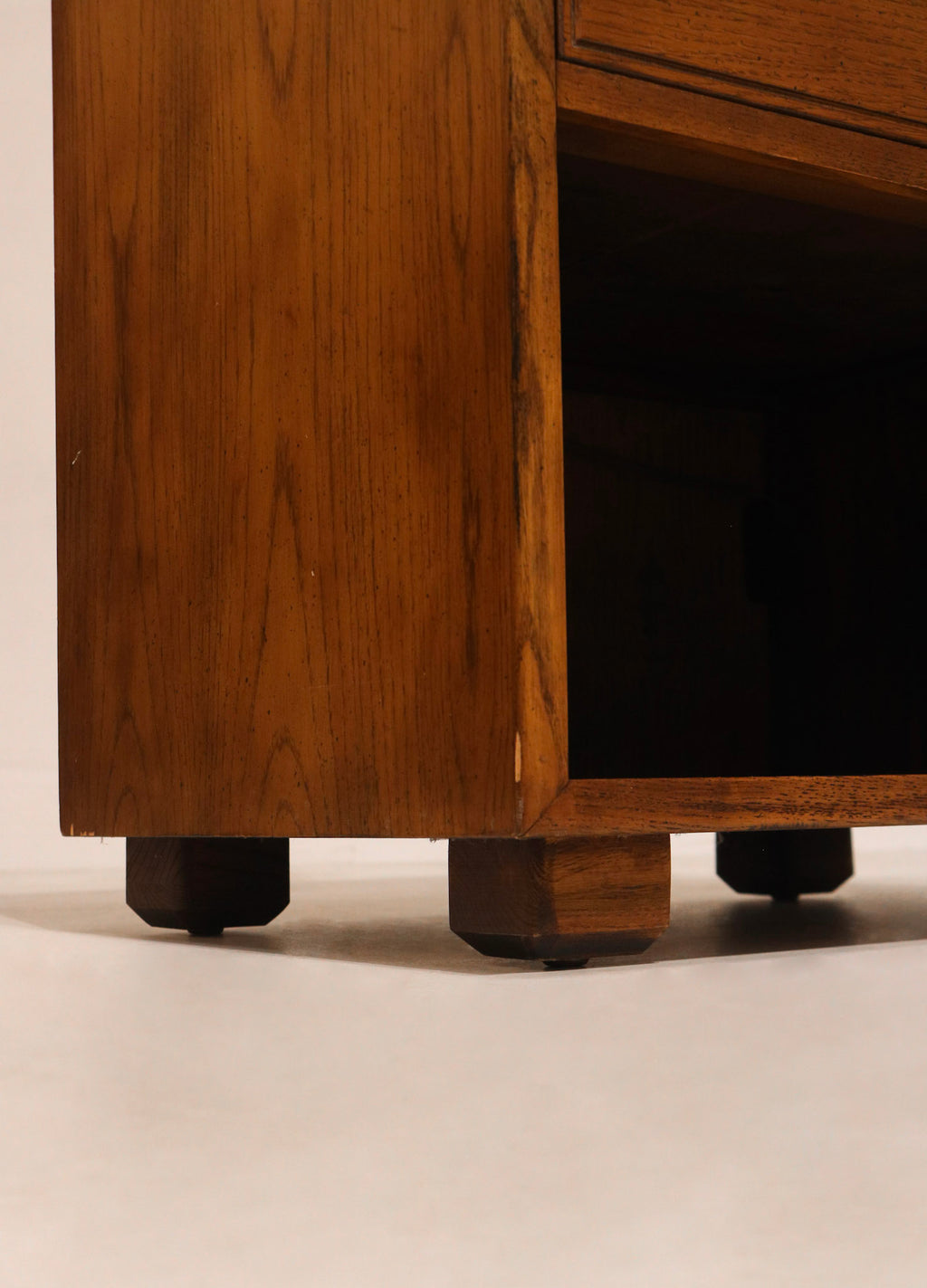 Close-up of side panel showcasing mid-century craftsmanship and natural oak finish