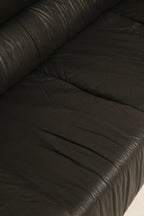 Rear view of the leather sofa showing clean lines and consistent leather finish