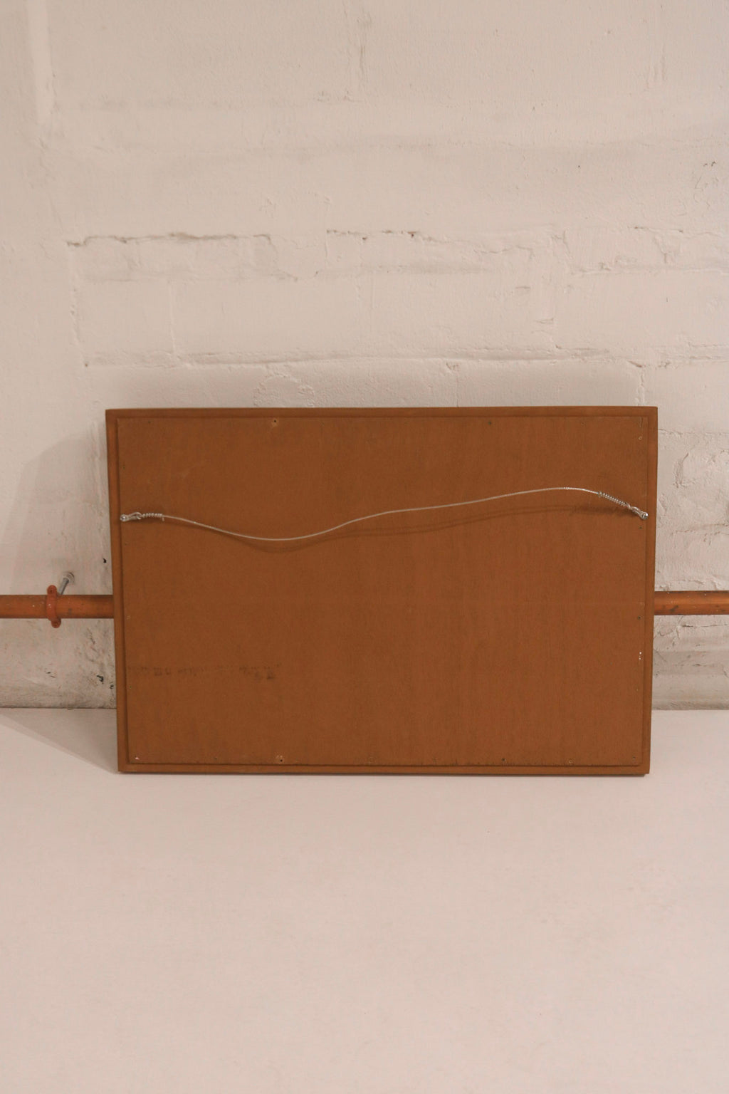Close-up of golden wooden frame corner detailing, highlighting vintage craftsmanship and texture
