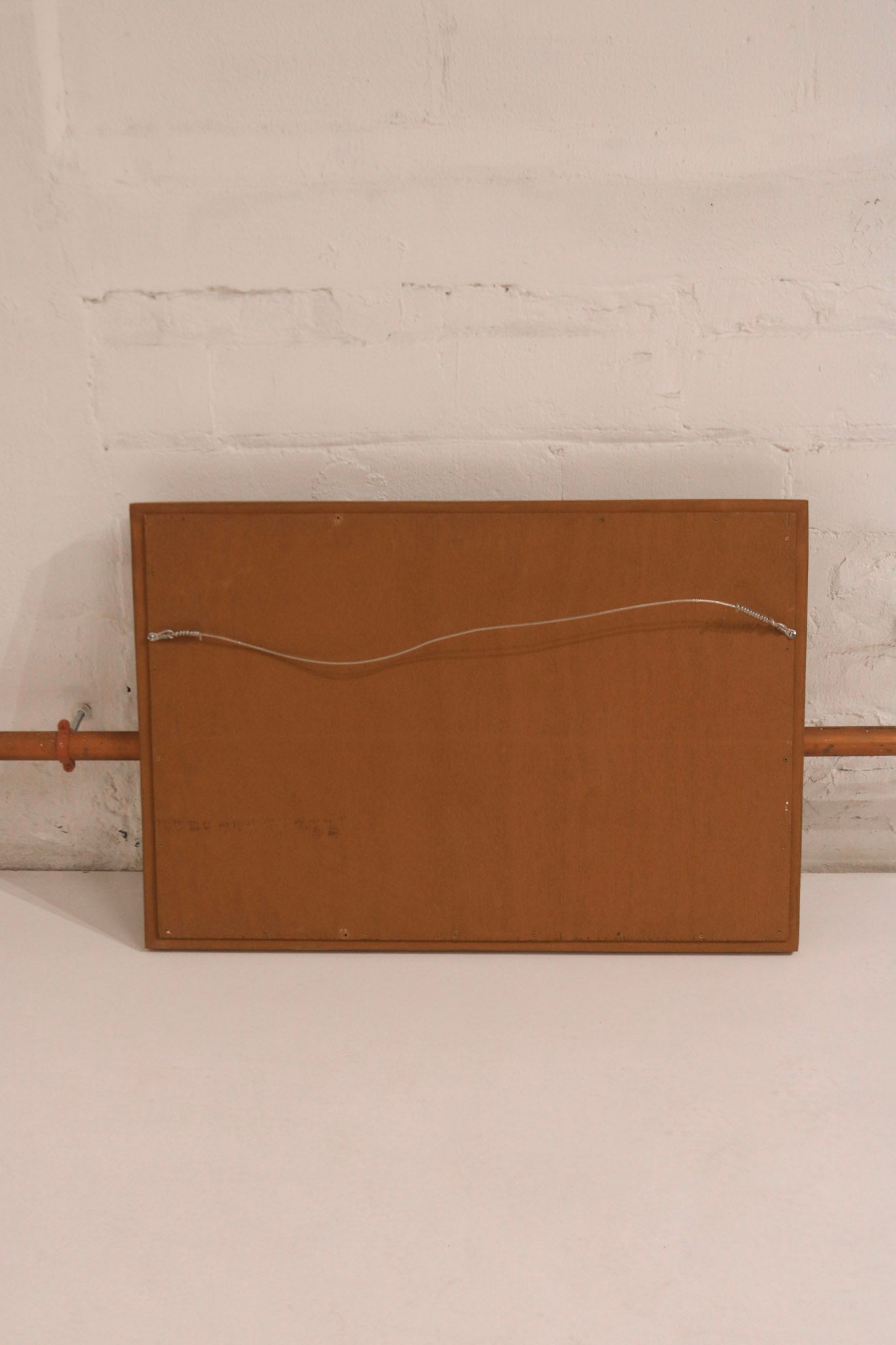 Close-up of golden wooden frame corner detailing, highlighting vintage craftsmanship and texture