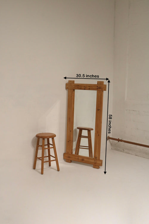 Close-up of the 1970s mirror showing detailed wood grain