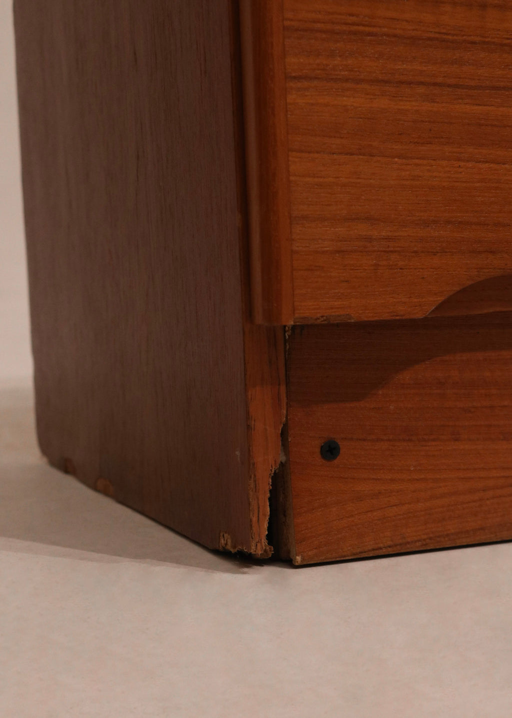 Angle shot showing all 9 drawers and symmetrical layout of the MCM teak dresser