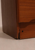 Angle shot showing all 9 drawers and symmetrical layout of the MCM teak dresser