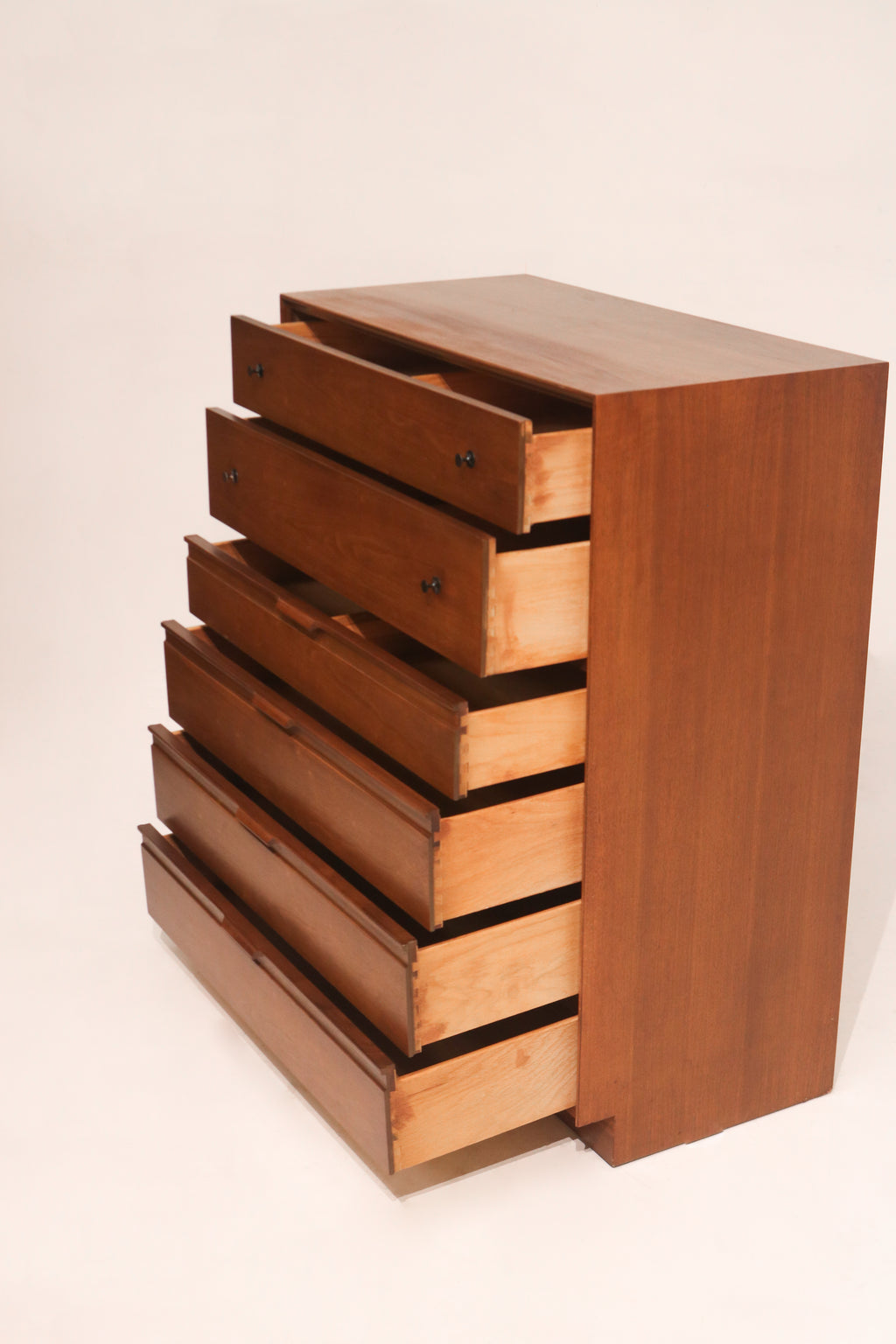 Close-up of dresser top surface displaying rich walnut pattern with minimal wear