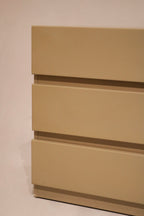 Side view angle highlighting taupe and olive color blend under lacquer finish