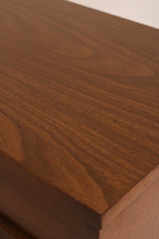 Close-up of light surface scratches on veneer top of walnut bedside table
