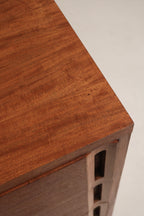 Close-up of stained walnut top surface on vintage solid wood dresser, sanded finish highlighting natural wood grain and subtle patina