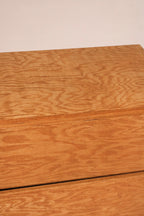 Drawer interior in plywood with clean lines and sturdy build, showing functionality