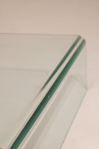 View of the table’s solid glass legs and junction points showing high craftsmanship and structure