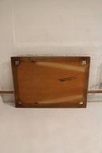 Finish detail on solid oak wood frame showing light surface scratches, worn corners, varnish wear and vintage character.