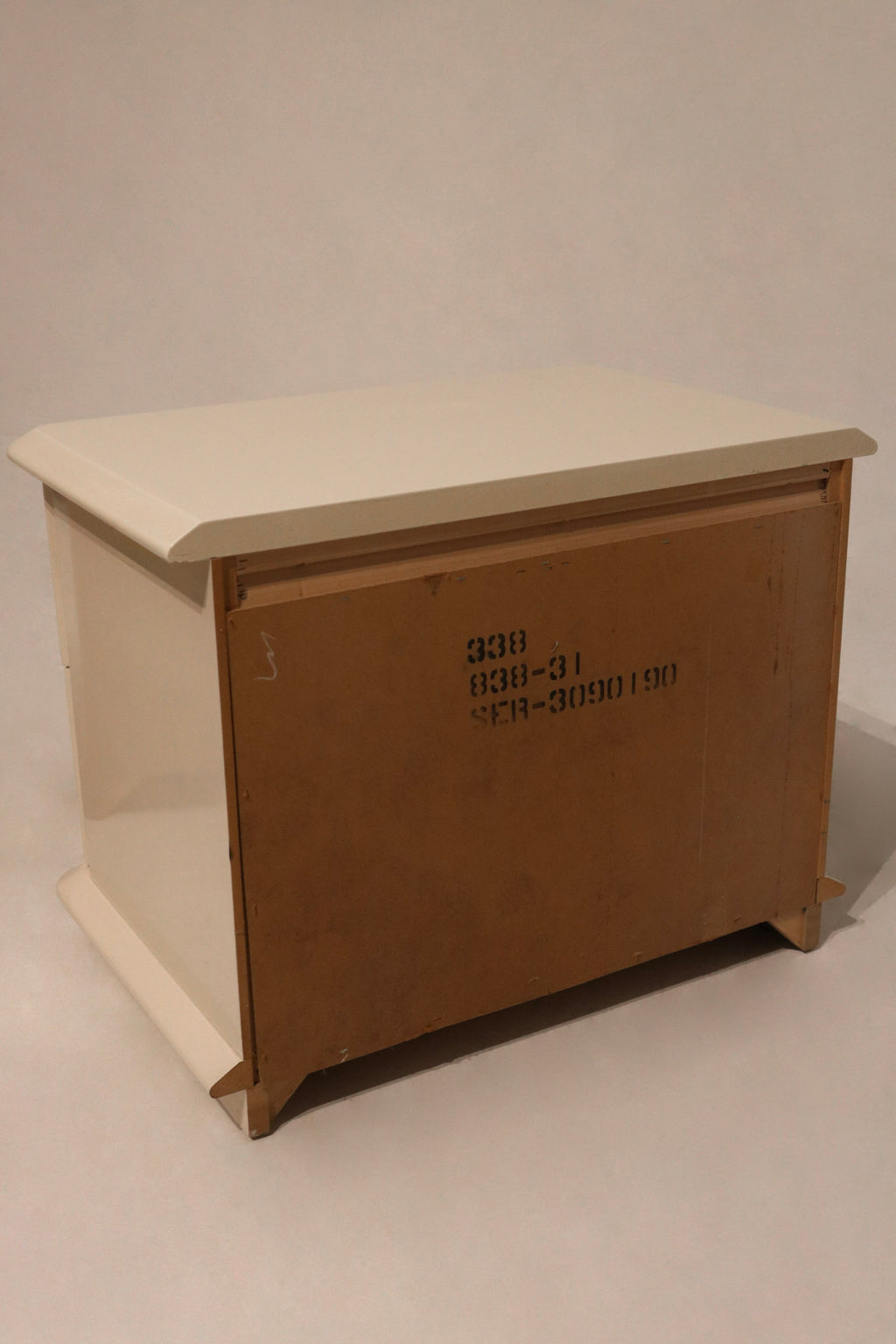 Interior view of one open drawer with visible clean wooden interior space