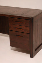 Rear view of desk showing smooth stained oak finish and structural integrity