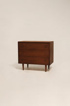 Full view of Mcm vintage small dresser made of walnut wood with sleek mid-century design