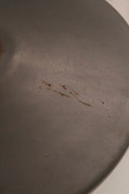 Side angle showing steel legs and chromel base construction with slight wear visible