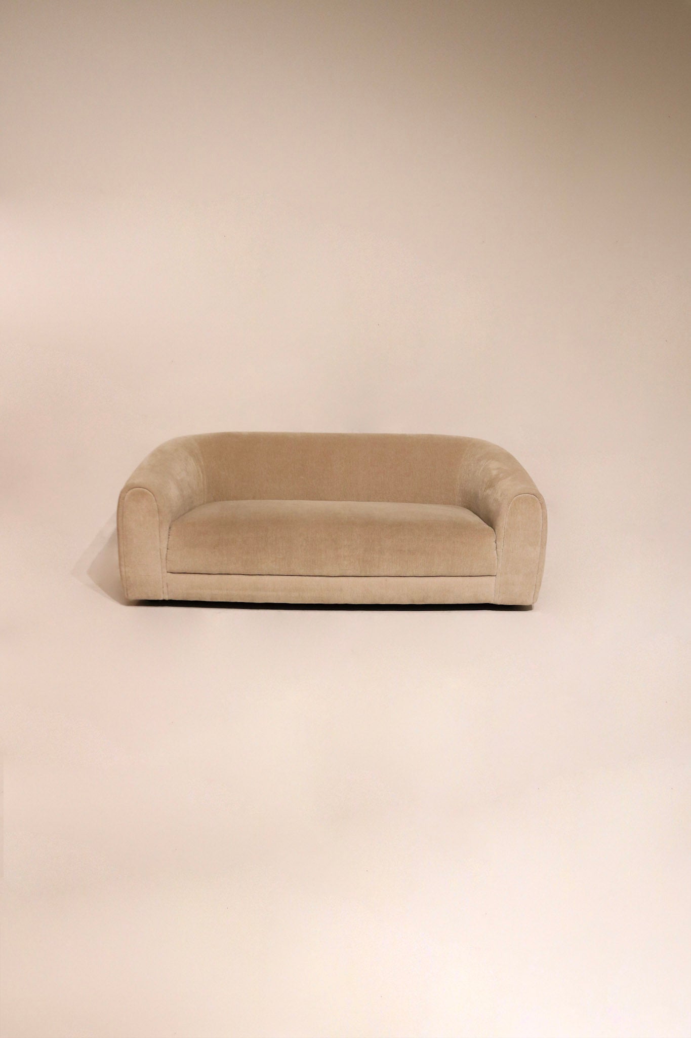 Full view of Contemporary West Elm Champagne Velvet Sofa Couch with clean champagne fabric upholstery
