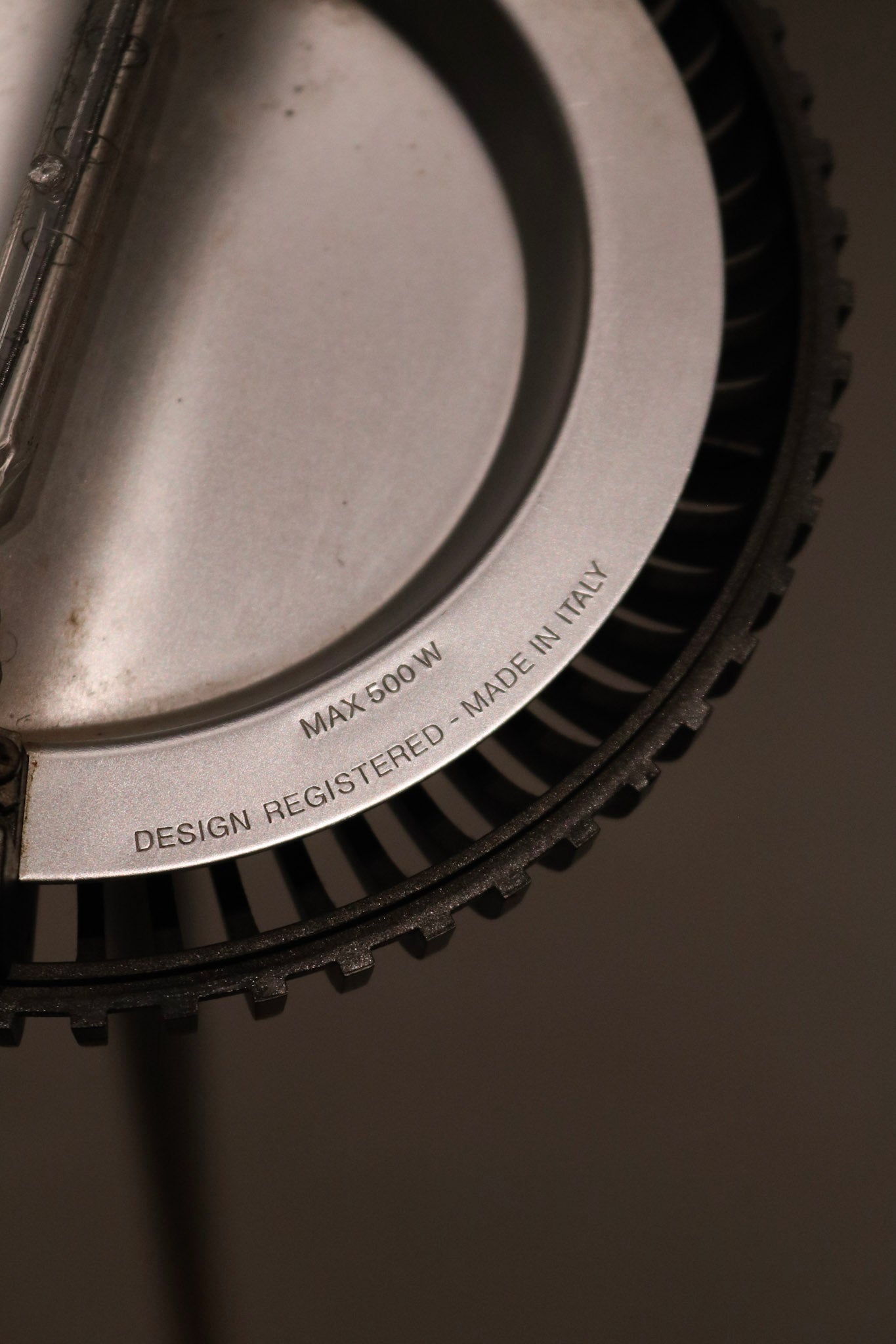Detail of glass curvature along lamp body, emphasizing sculptural silhouette