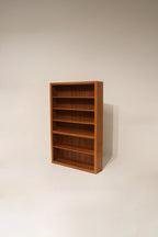 Front view of vintage Mid-Century Modern tall wood cabinet with closed doors