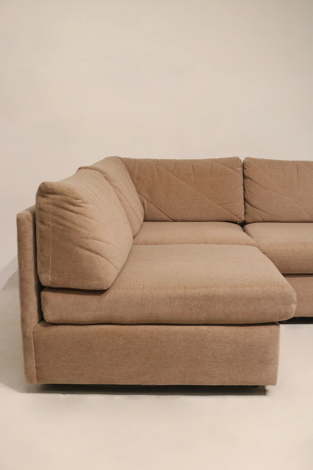 Image of back panel and seam join on Mcm sectional fabric sofa illustrating tight tailoring and original vintage upholstery finish