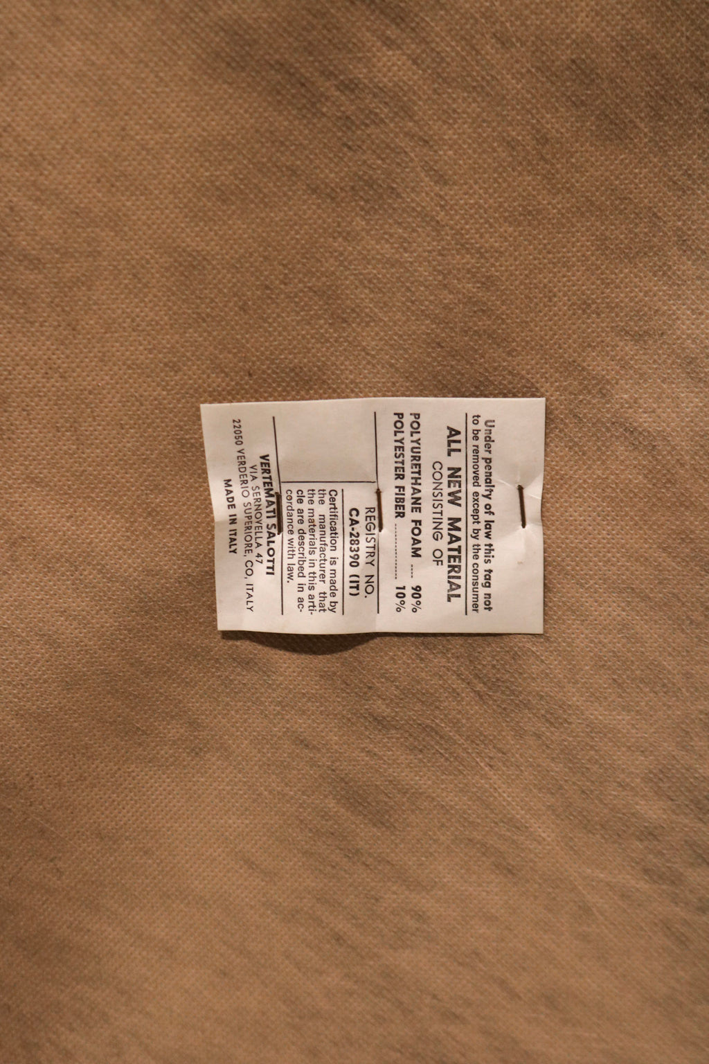 Textured view of seat cushion on real leather vintage sofa, soft yet firm padding