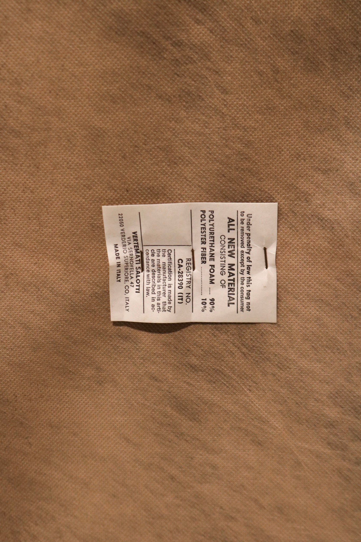 Textured view of seat cushion on real leather vintage sofa, soft yet firm padding