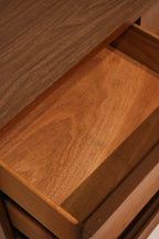 Rear panel of walnut dresser showing veneer finish and structural integrity