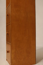 Top-down perspective showing the slim profile of tall oak wood cabinet
