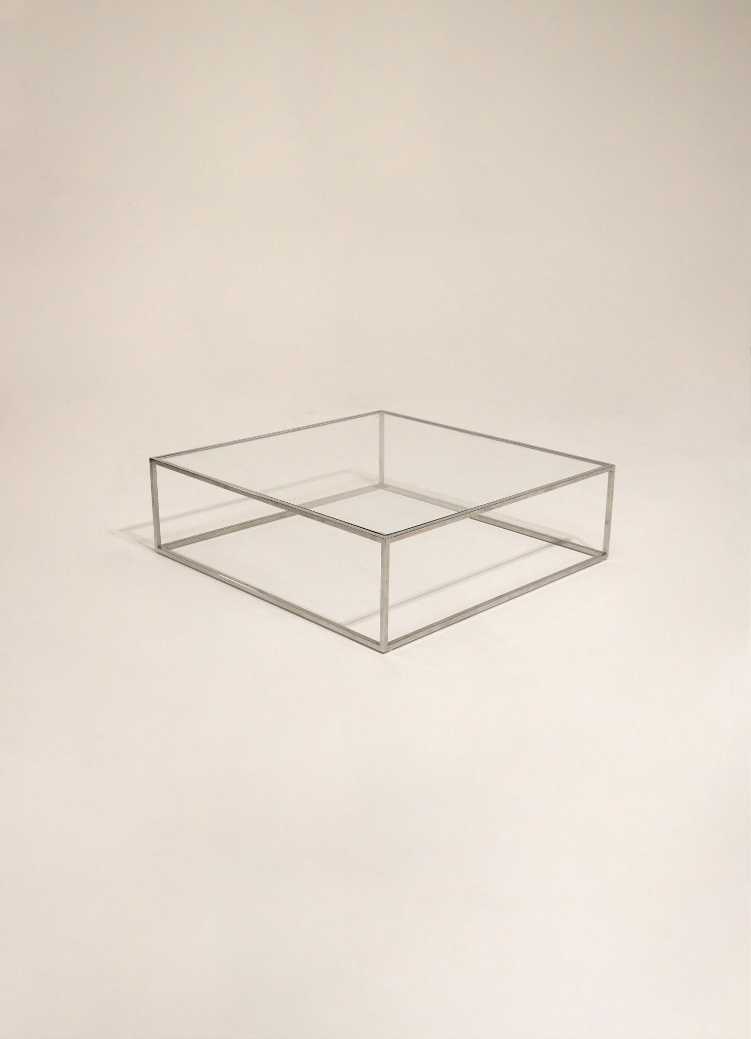 Stylish glass top table with chrome frame