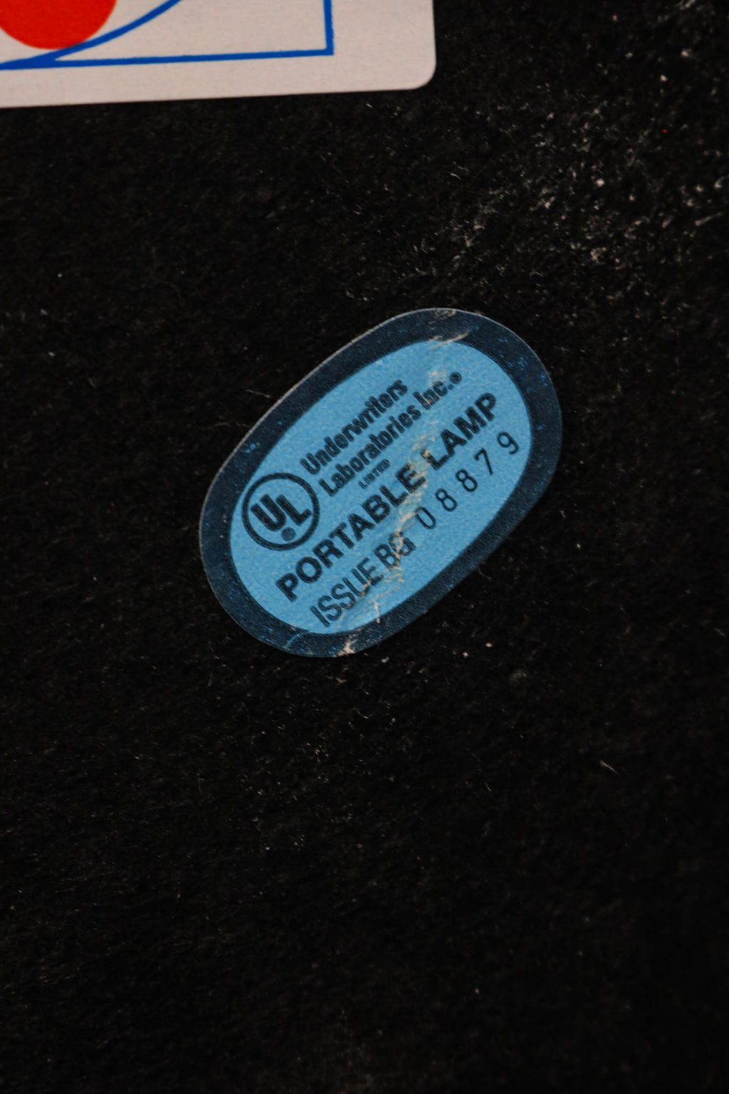 Close-up of chrome steel lamp head with adjustable joint and sleek vintage finish