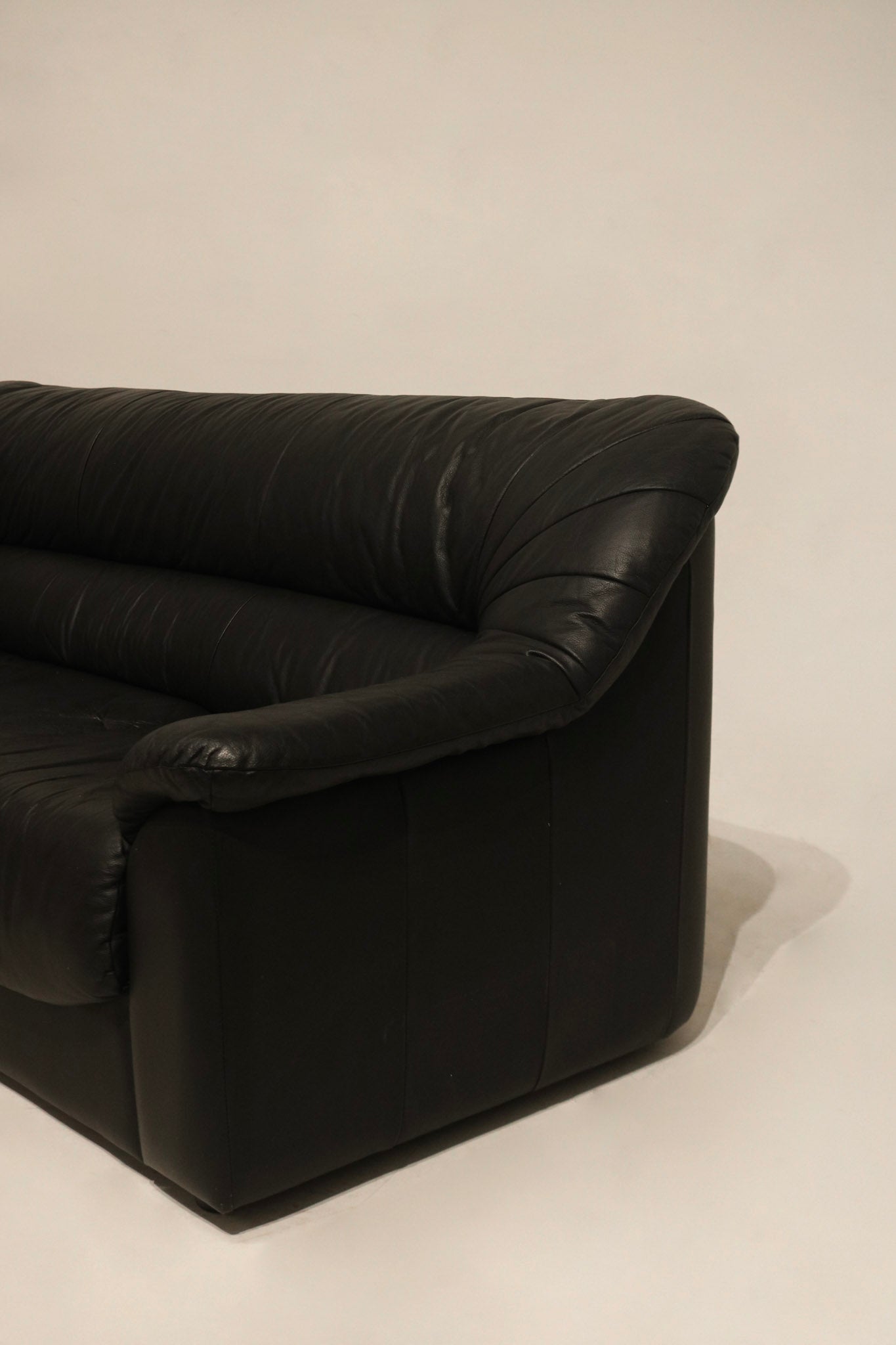 Side angle of the Italian leather sofa showcasing proportions and sleek profile