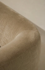 Detail of upholstery stitching and reinforcement, champagne velvet fabric, durable construction at seams and corners for long-lasting use