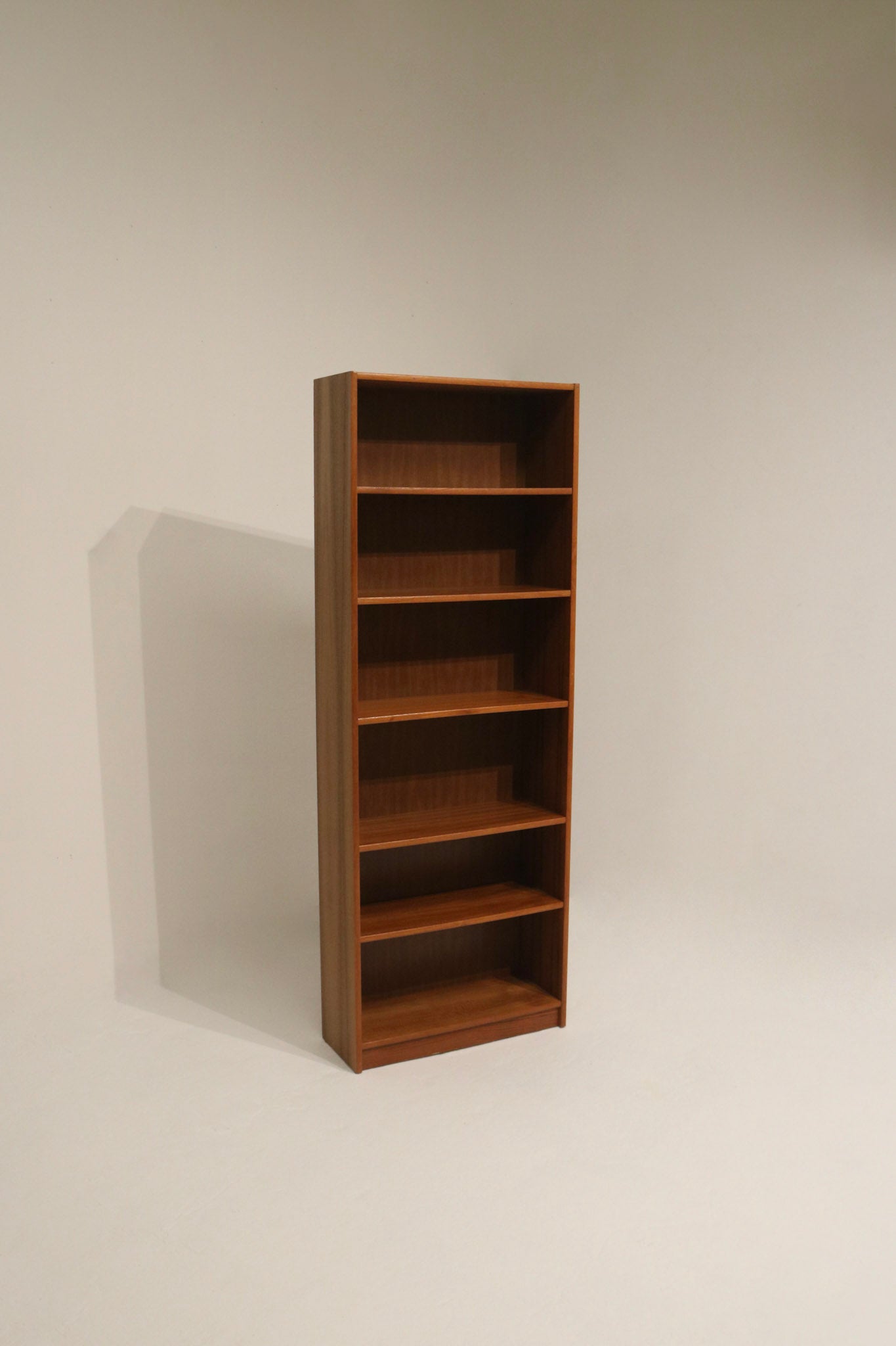 Elegant teak shelf unit with adjustable shelves
