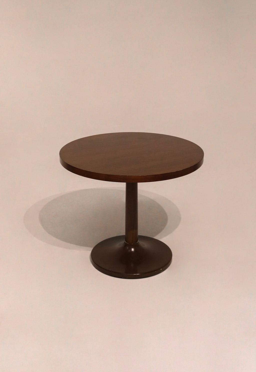 Full view of wooden round bistro dining table showing smooth wood finish and sturdy base