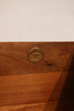 Wood grain detail on dresser front panels, highlighting the intricate burl pattern